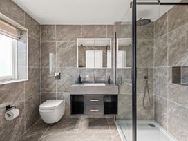 A bathroom with a shower, sink, and toilet at Capton Snug in Capton near Dartmouth