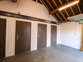 A storage room with multiple doors at Bramble Cottage Thornthwaite near Braithwaite