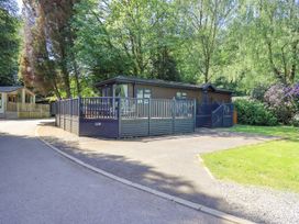 A house with a fenced area and steps at Evermore Lodge, 48 Calgarth Park, White Cross Bay, Windermere
