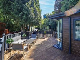 An outdoor area with seating and plants at Evermore Lodge, 48 Calgarth Park, White Cross Bay, Windermere