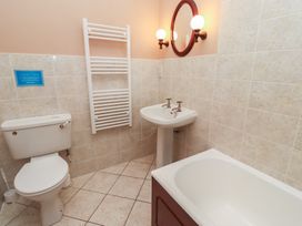 A bathroom with a toilet sink bathtub and towel rack at Primula Patch in Akeld near Wooler