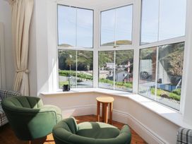 A living room with a window and chairs at Brynmorfa in Llandysul