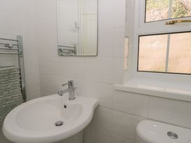 A bathroom with a sink and toilet at Brynmorfa in Llandysul