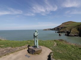 A statue overlooking the ocean at Brynmorfa in Llandysul