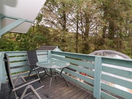 A deck with a table and chairs at Scarba in Oban