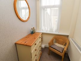 A corner with a dresser and a chair at 2 The Crescent 