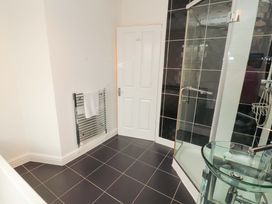 A bathroom with a shower and towel radiator at 2 The Crescent