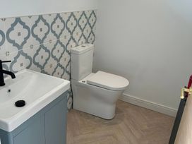 A bathroom with a sink and toilet at Seaddler in Trearddur Bay