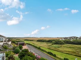 A view of houses and open fields at Seaddler in Trearddur Bay