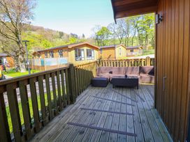 A deck with outdoor furniture at Dovestone Luxury Lodges (sleeps 4)- pet free Greenfield