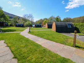 Outdoor area with cabins and pathway at Dovestone Luxury Lodges (sleeps 4)- pet free Greenfield