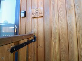 An entrance door with wooden paneling at Ashway Gap Lodge in Greenfield