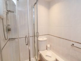 A bathroom with a shower and toilet at Rutland Grange in Filey