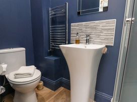 A bathroom with a sink and toilet at Rutland Grange in Filey