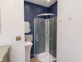 A bathroom with a shower and sink at Rutland Grange in Filey