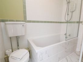 A bathroom with bathtub and shower at Rutland Grange Filey