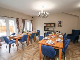 A dining room with tables and chairs at Rutland Grange in Filey