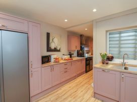 A kitchen with cabinets and appliances at Rutland Grange in Filey