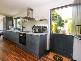 A kitchen with a counter and sink at Y Cwt Moelfre