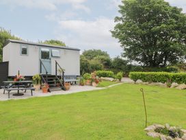 An outdoor area with a house-shaped structure and garden at Teg in Prospidnick near Porthleven