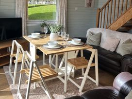 A dining room with a table and chairs at Number 39 Bodmin