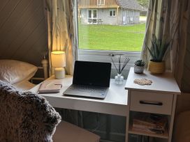 A bedroom with a desk and laptop at Number 39 Bodmin