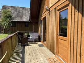 An outdoor area with seating and potted plant at Number 39 in Bodmin