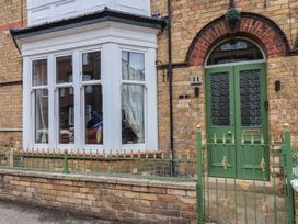 Exterior view of a house with a green door at 11 Rutland Street in Filey