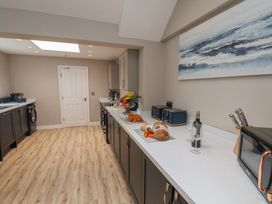A kitchen with a counter and appliances at 11 Rutland Street Filey