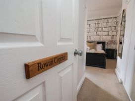 A doorway leading to a bedroom with bookshelves at 11 Rutland Street in Filey