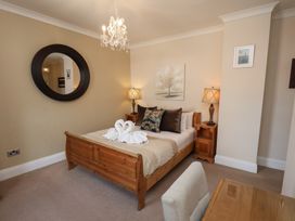 A bedroom with a bed and nightstand at 11 Rutland Street in Filey