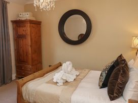 A bedroom with a bed and wardrobe at 11 Rutland Street Filey