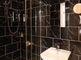 A bathroom with a shower and sink at 11 Rutland Street, Filey