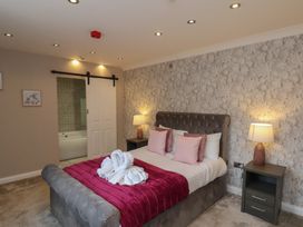 A bedroom with a bed and nightstand at 11 Rutland Street in Filey