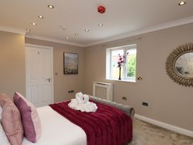 A bedroom with a bed and wall decoration at 11 Rutland Street in Filey