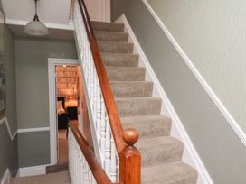 A staircase in a hallway at All Seasons in Filey