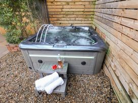 A hot tub with steps and a drink at All Seasons in Filey