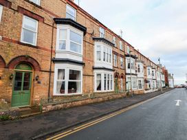 A street with brick buildings and bay windows at All Seasons in Filey