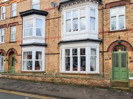 A building exterior with windows and a door at All Seasons in Filey