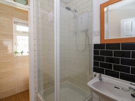 A bathroom featuring a shower and sink at Flat 8 in Burnham-on-Sea