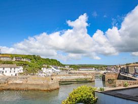 A harbor with water and buildings in Porthleven