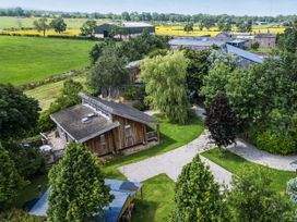 An outdoor view of houses and farm buildings at Cedrus Lodge in Skelton near Penrith