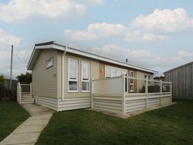 A house with a deck and garden at Platinum Lodge (503) Talybont