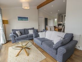 A living room with sofas and a coffee table at Platinum Lodge (503) Talybont
