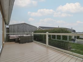 A balcony with a couch and view of surrounding area at Platinum Lodge (503) Talybont