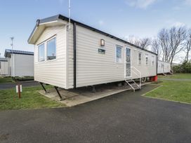 A mobile home with steps and windows at Lido Silver Plus 111 Prestatyn