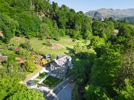 A house surrounded by garden and trees at Riverside in Ambleside