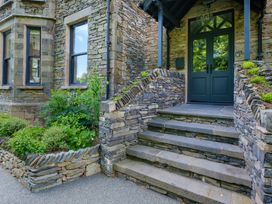 A front entrance with stone steps and a door at Riverside in Ambleside