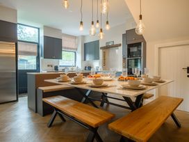 A kitchen with a dining table set for meals at Riverside in Ambleside