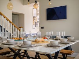 A dining room with a set table at Riverside in Ambleside